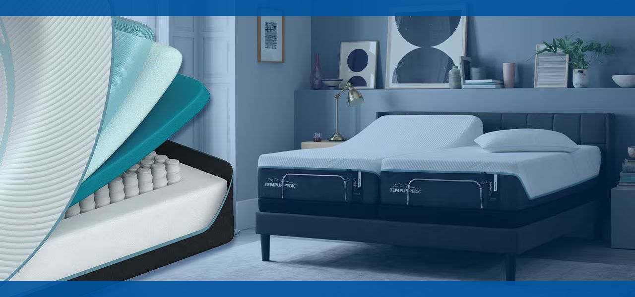 A modern bedroom with an adjustable bed and layered mattress.