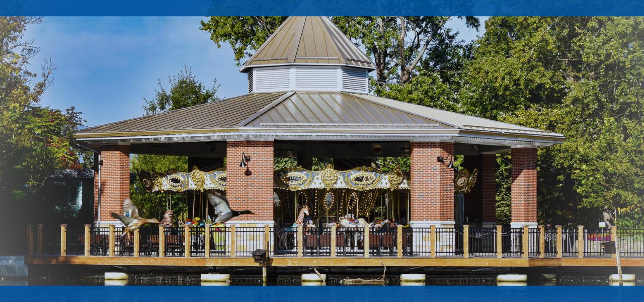 A gazebo surrounded by trees on a sunny day.