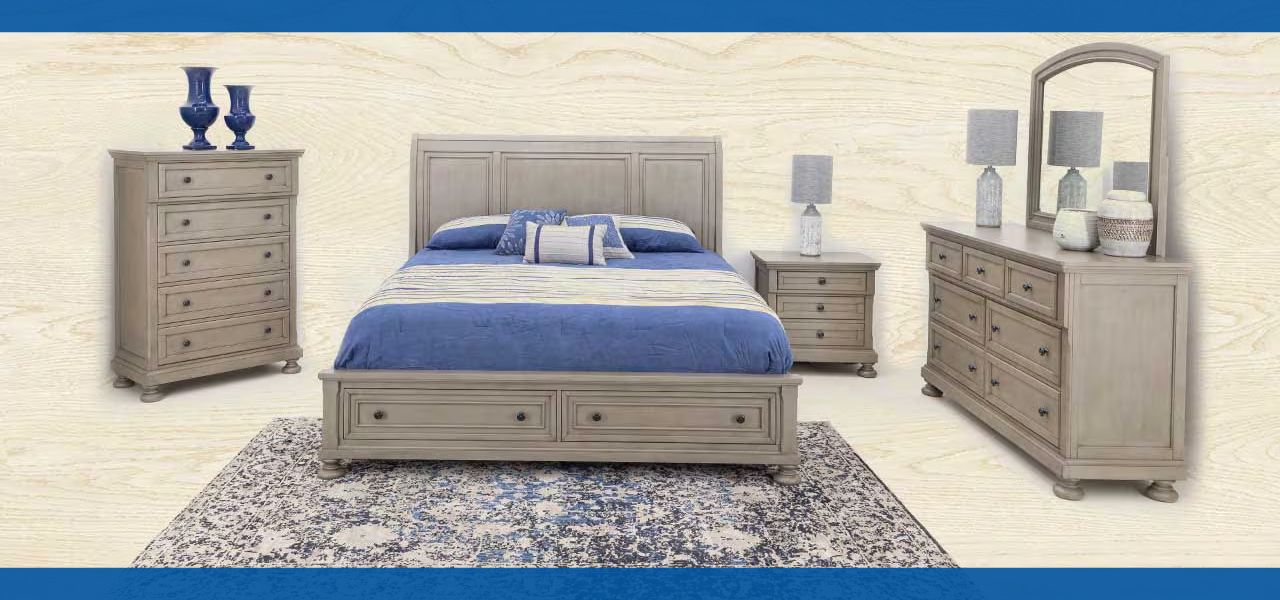 Bedroom furniture set with a bed, nightstands, dresser, and decorative accessories.