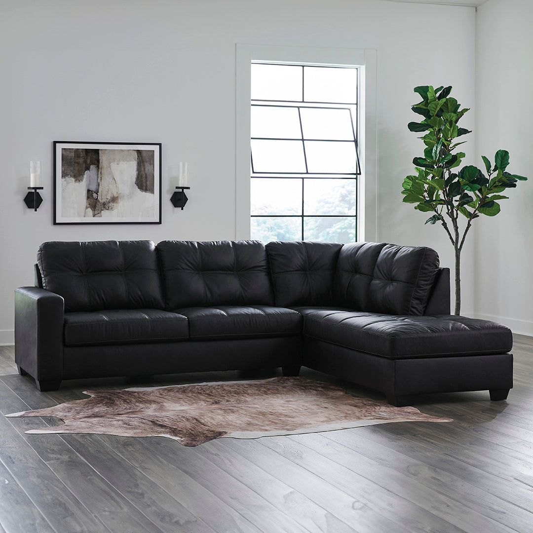 Barlin Mills sectional with right chaise by Signature Design by Ashley in black upholstery styled in a living room