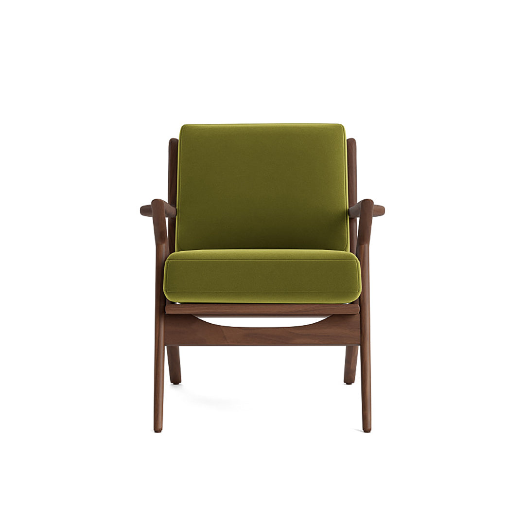 Joybird modern armchair with green cushions and wooden frame