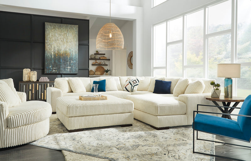 Contemporary living room featuring a clean, comfortable sectional sofa and accent pillows