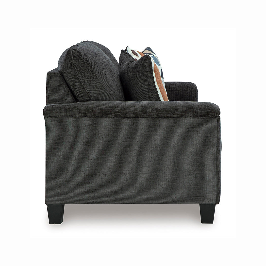 Side view of Erinslane sofa by Ashley Furniture with accent pillows