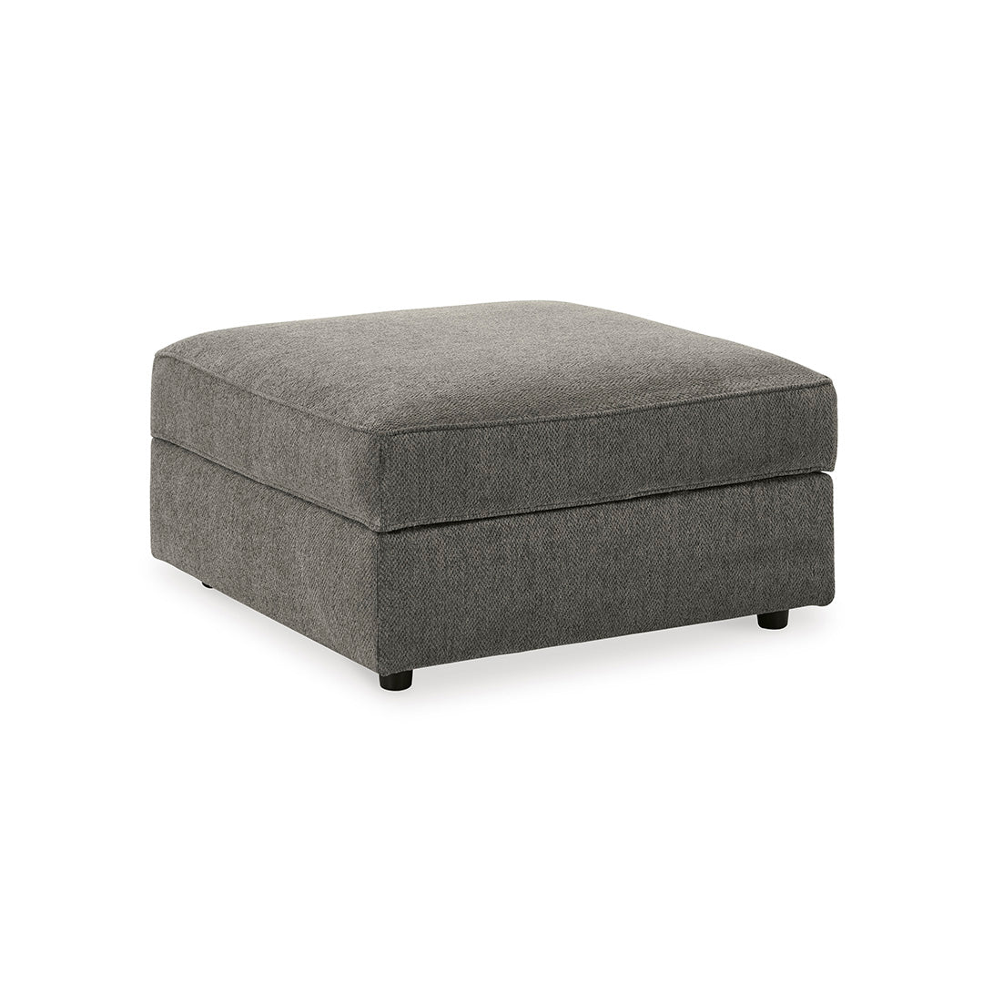 Gray upholstered ottoman on a white background