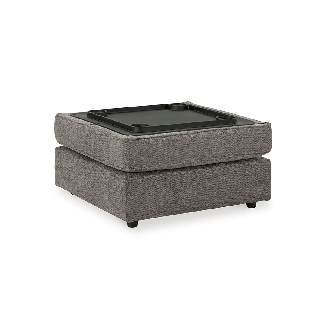 Gray ottoman with a black tray on a white background