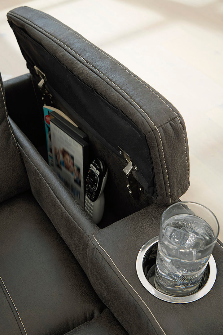 Batavia Pier reclining sofa by Ashley Furniture with hidden arm storage and cup holder