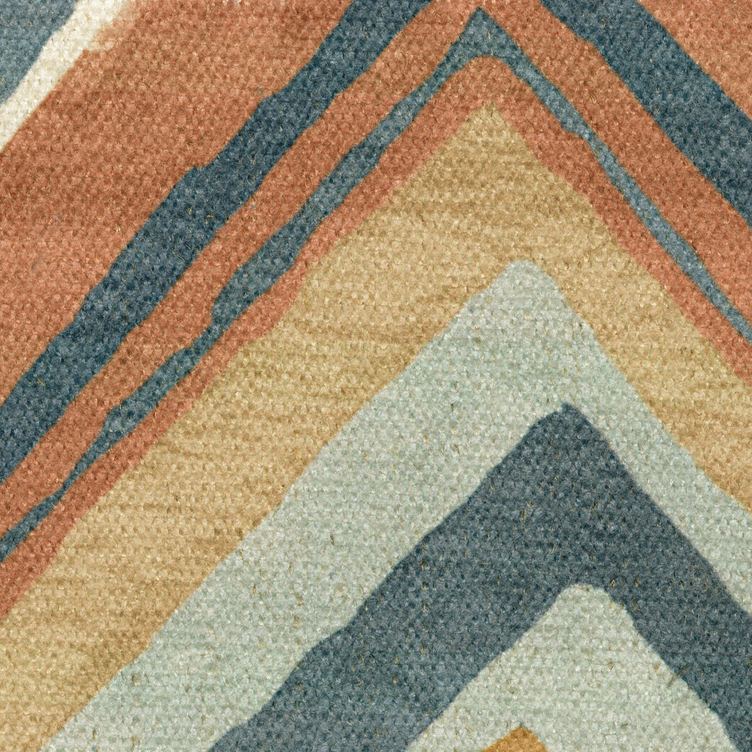 Close-up of a textured fabric with geometric pattern in earthy tones.