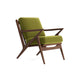 Joybird modern armchair with green cushions and wooden frame