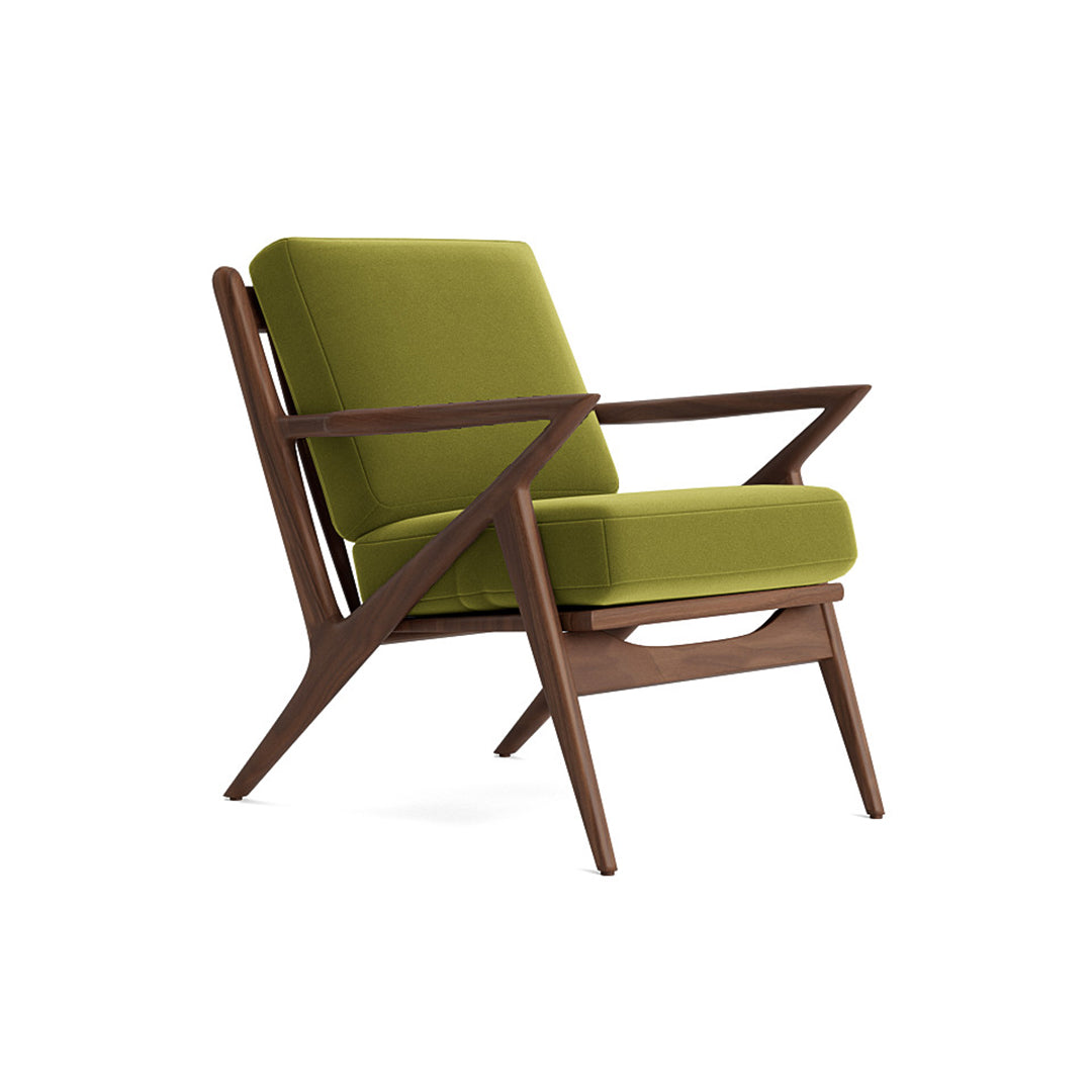 Joybird modern armchair with green cushions and wooden frame