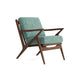 Joybird modern armchair with teal cushion and wooden frame background