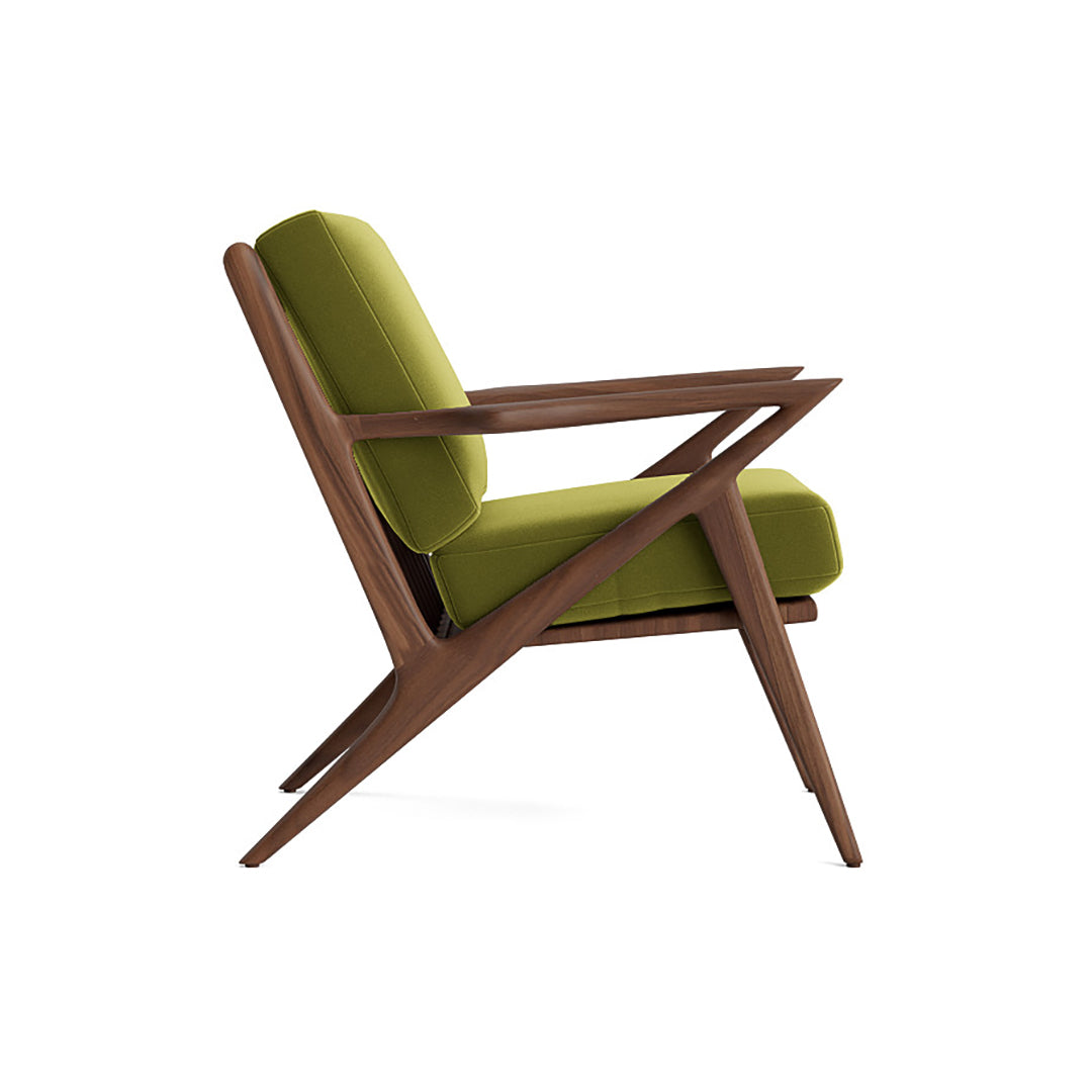 Joybird modern armchair with green cushions and wooden frame