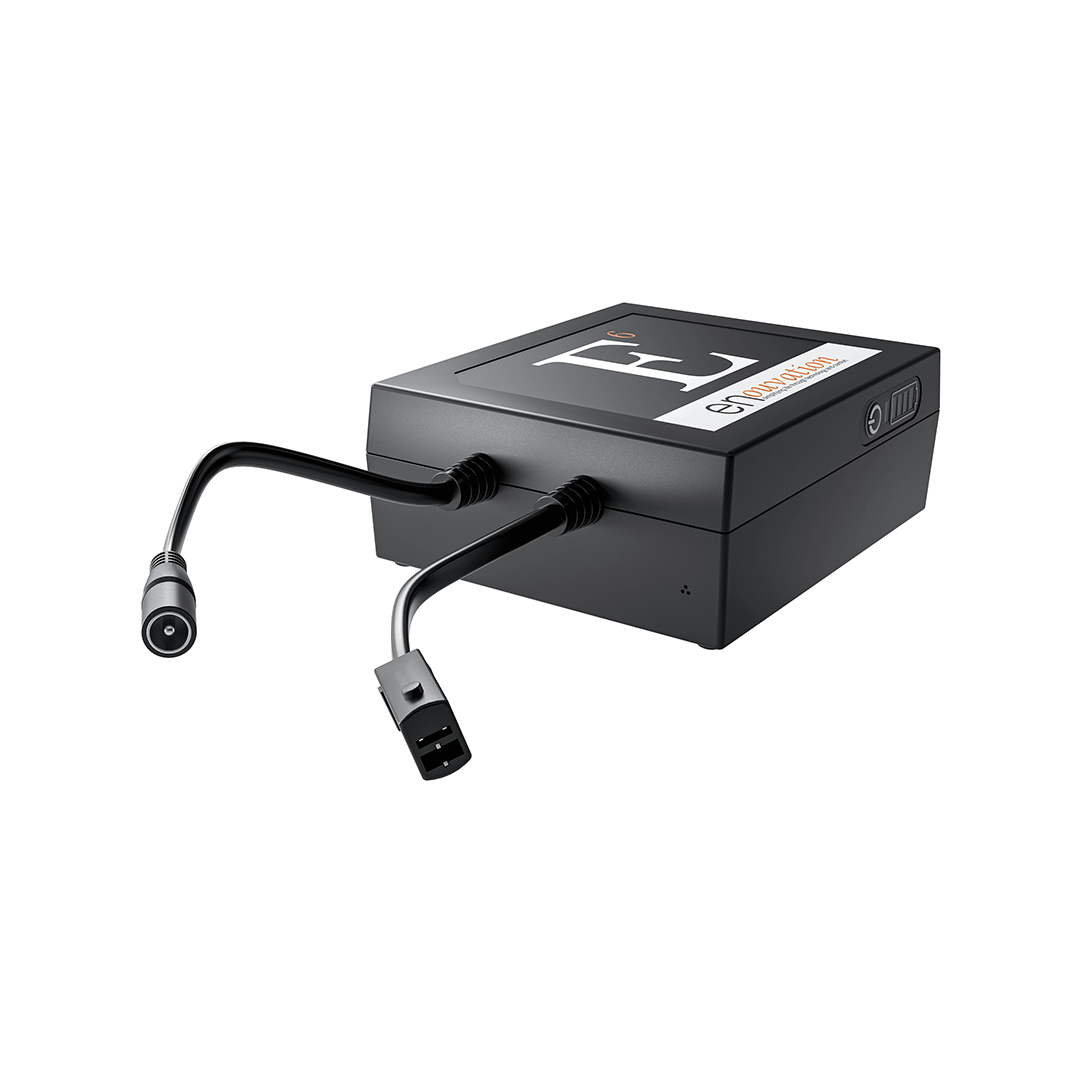 Black electronic device with cables on a white background