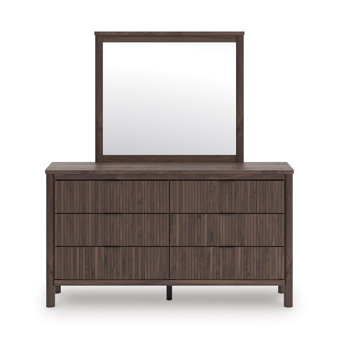 Wooden dresser with four drawers and a matching mirror on a white background