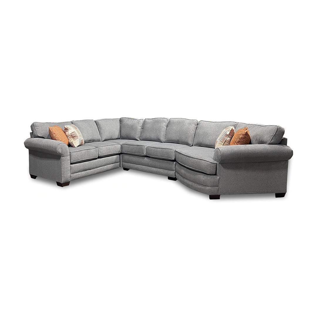 Gray sectional sofa with cushions on a white background