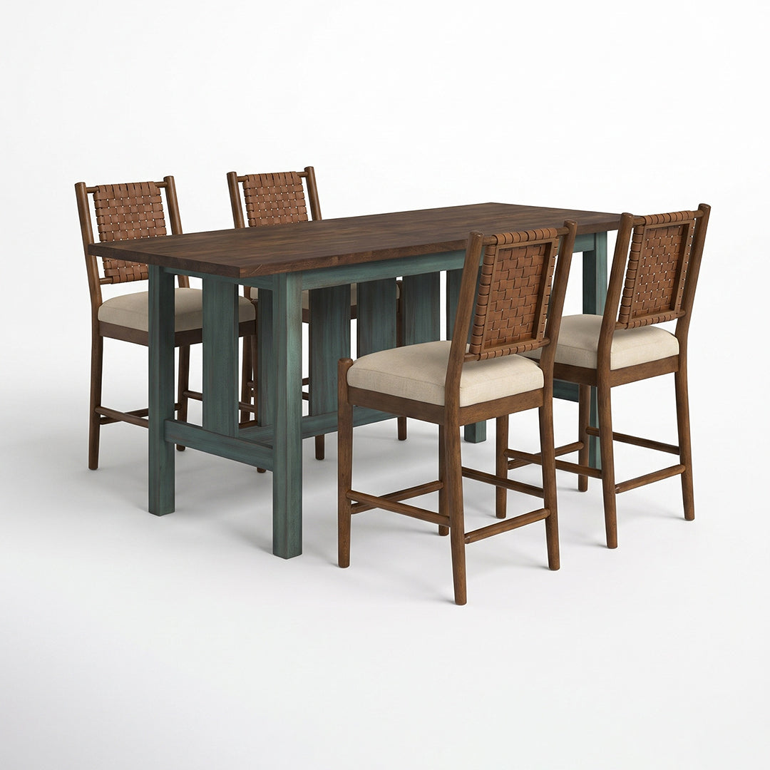 A 5-piece counter height dining set featuring a rectangular wooden table with a dark brown top and distressed teal legs, accompanied by four matching bar stools with woven brown backs and beige seat cushions.