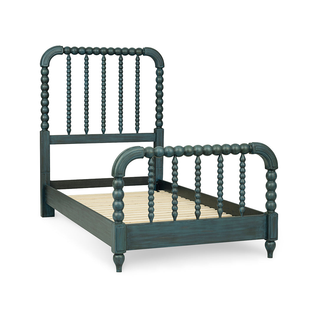 A dark teal painted wooden bed frame with turned spindle-style headboard and footboard rails.