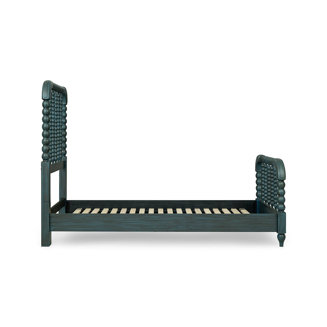 A dark teal wooden bed frame with woven rope headboard and footboard panels, shown from the side on a plain white background.