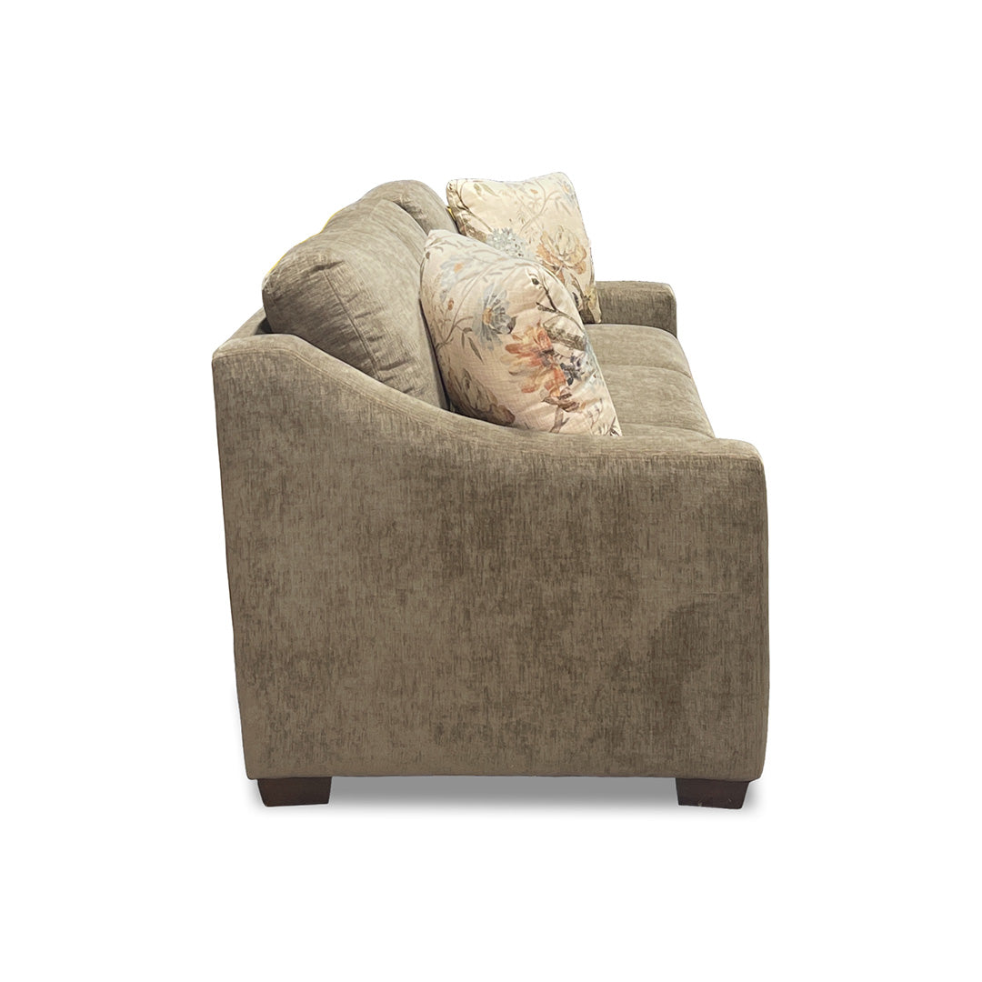 Brown sofa with floral pillow