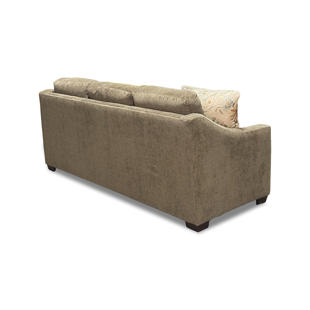 Brown sofa with a floral-patterned pillow