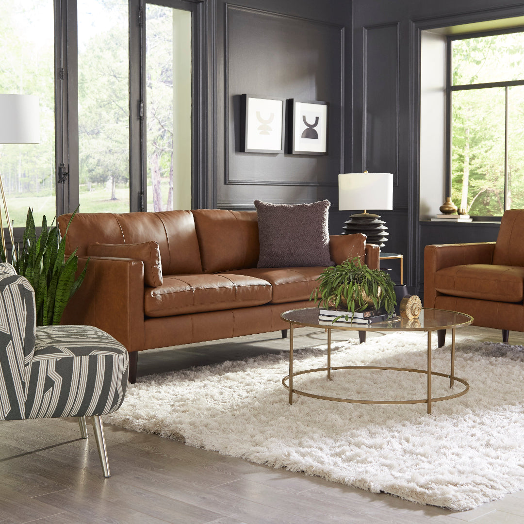 Trafton Living room by Best Home Furnishings with brown leather sofa, coffee table, and armchair.