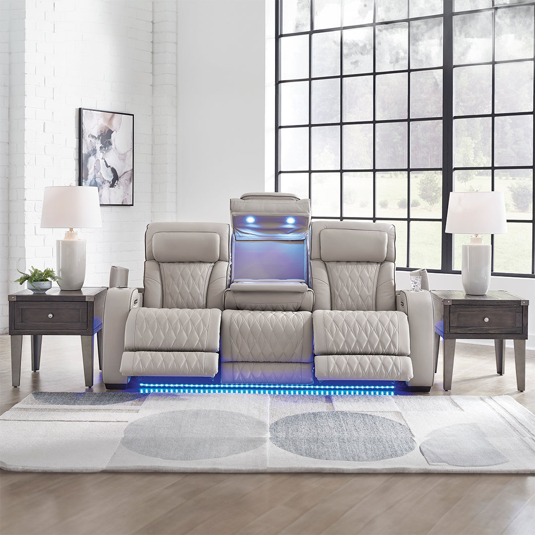 Three-seat Boyington power reclining sofa with quilted fabric and padded armrests