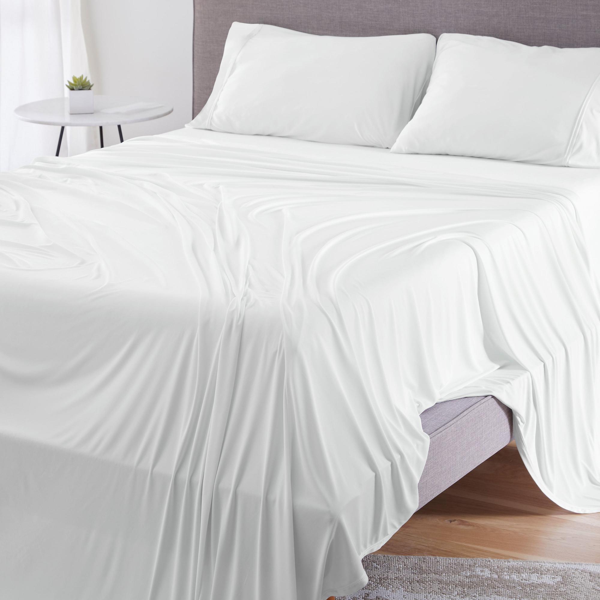 White Bedgear sheets on a neatly made bed