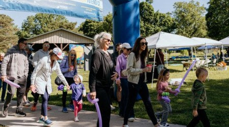 Cystic Fibrosis Foundation awareness walk with purple balloons