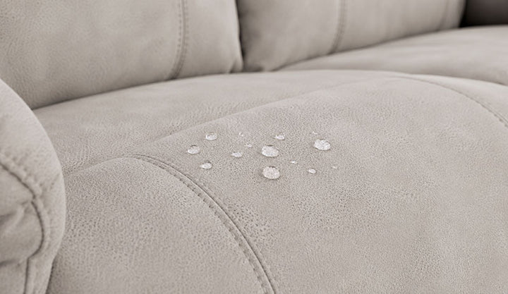 Water droplets beading up cleanly on the surface of Reliapel performance fabric
