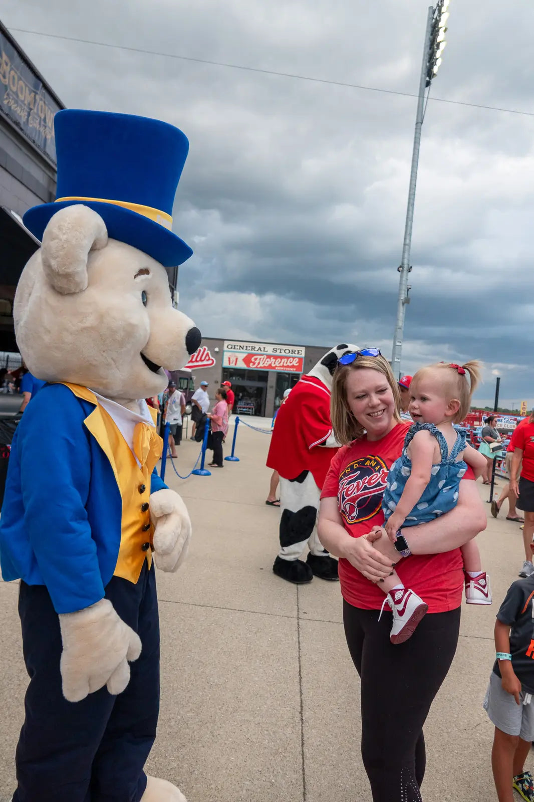 Share Bear mascot greeting a family outside a Northern Kentucky community event
