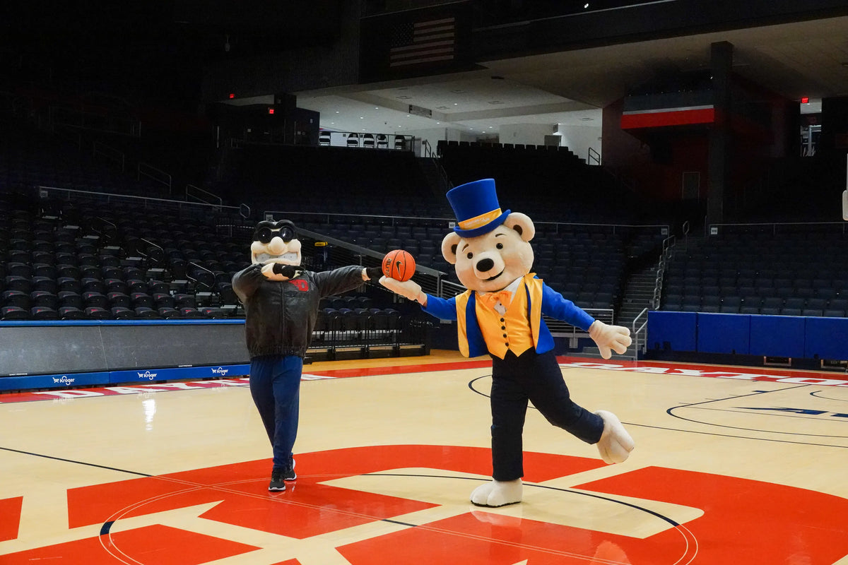 Share Bear mascot with another mascot at a University of Dayton arena community event