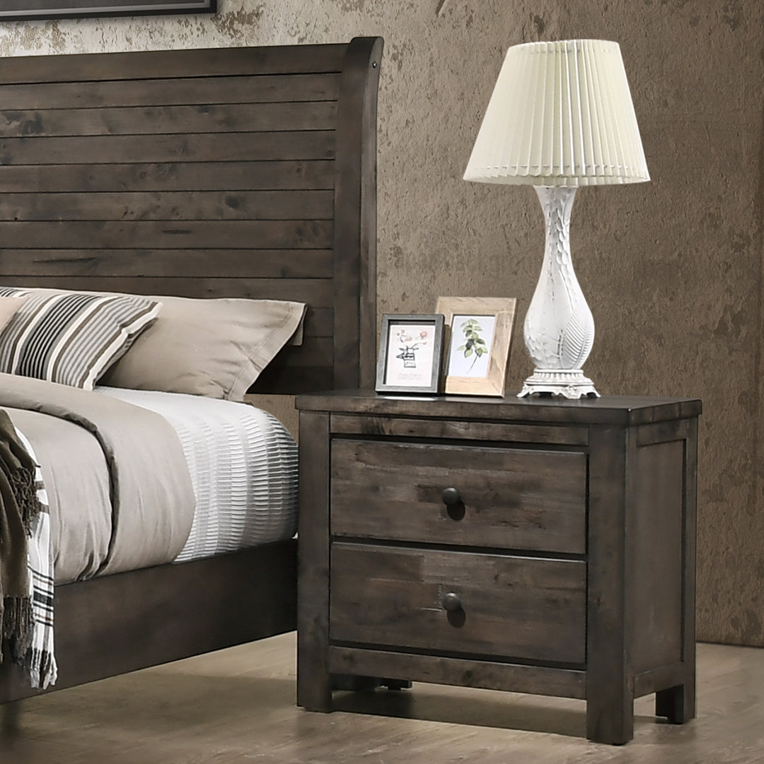 Bedroom setting with a wooden nightstand level with mattress height beside a styled bed