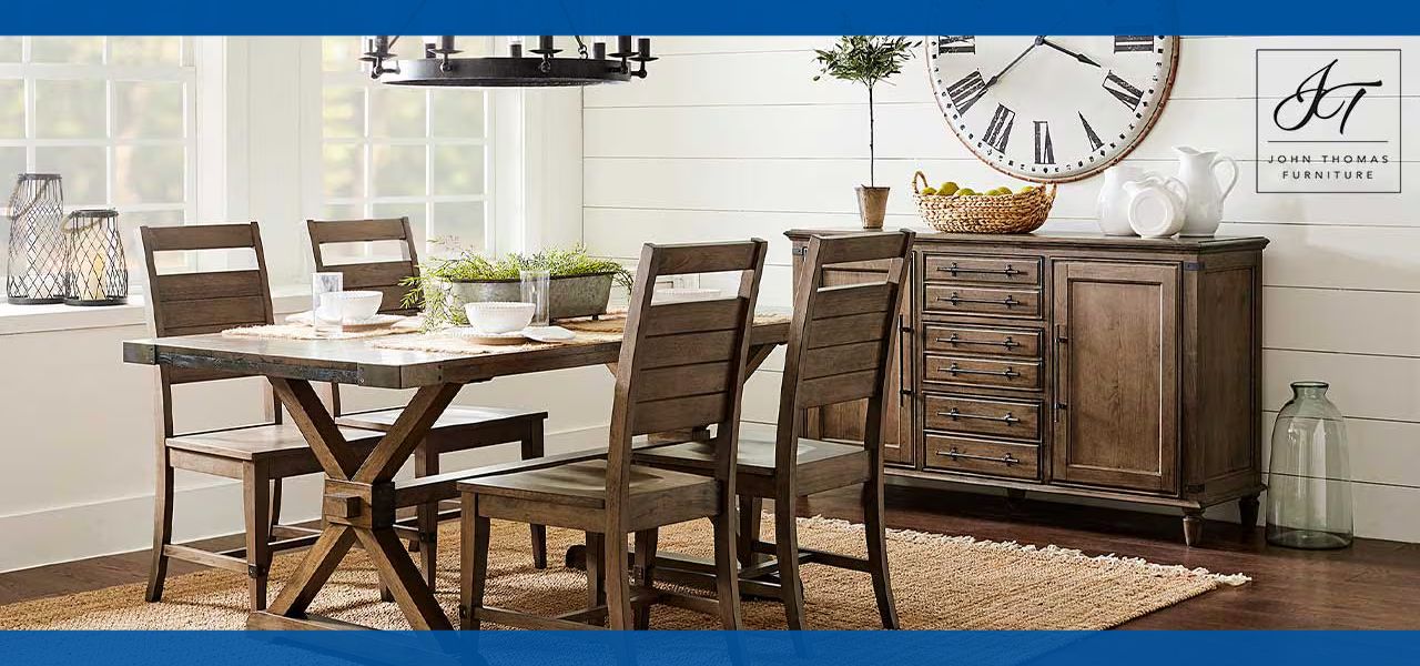 Dining room set with a table, chairs, and sideboard against a light backdrop.