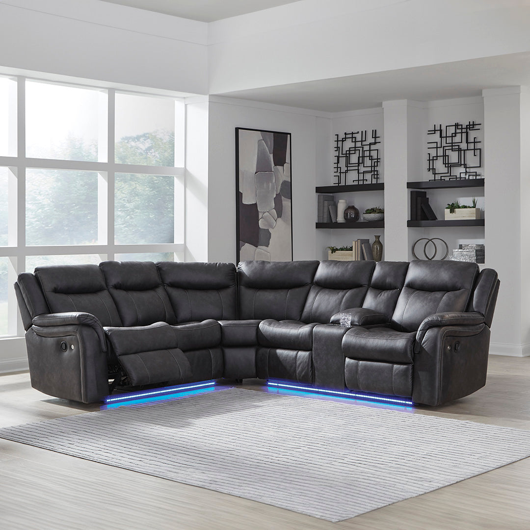 Black leather sectional sofa with LED lighting in a modern living room.
