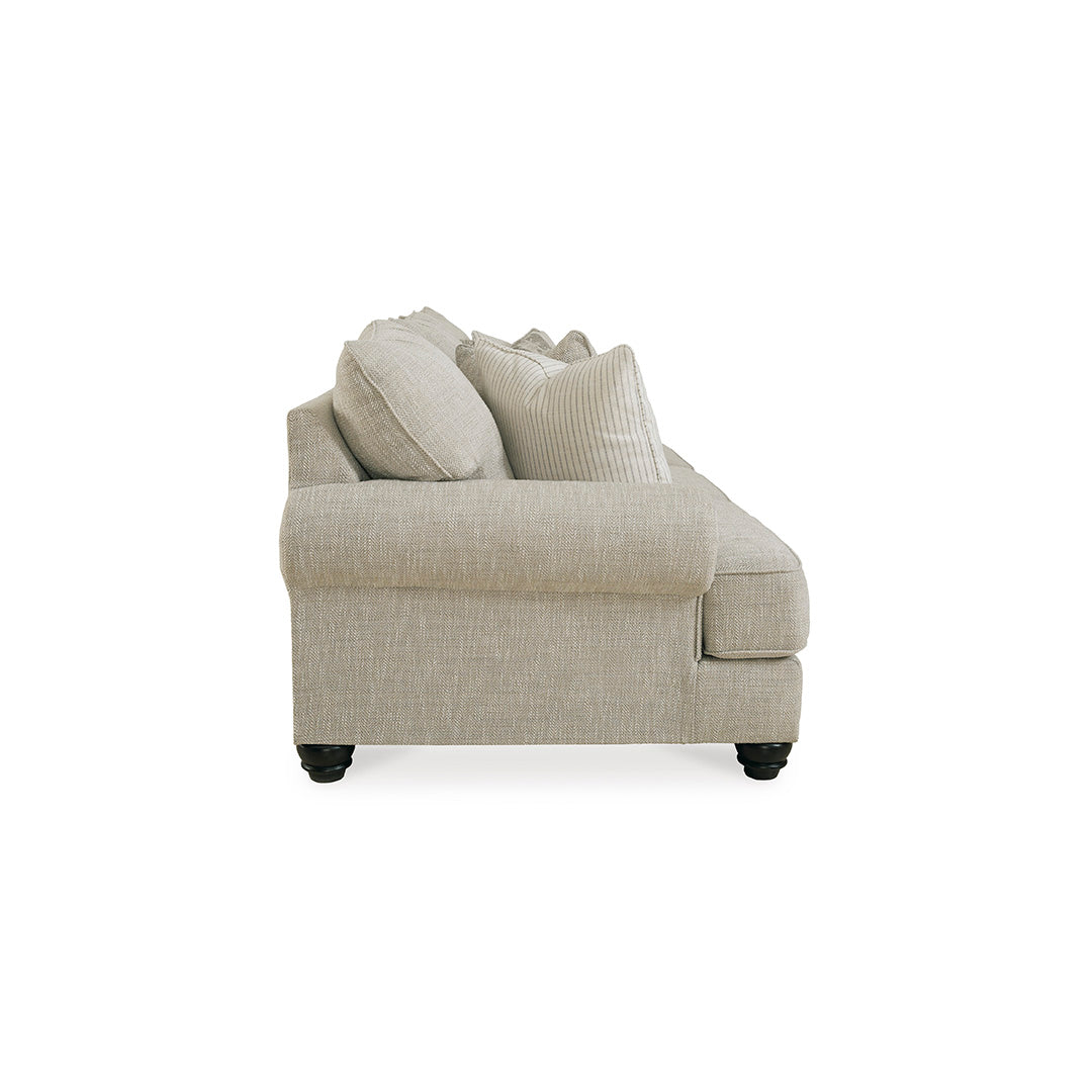 Beige sofa with chaise lounge on a white background