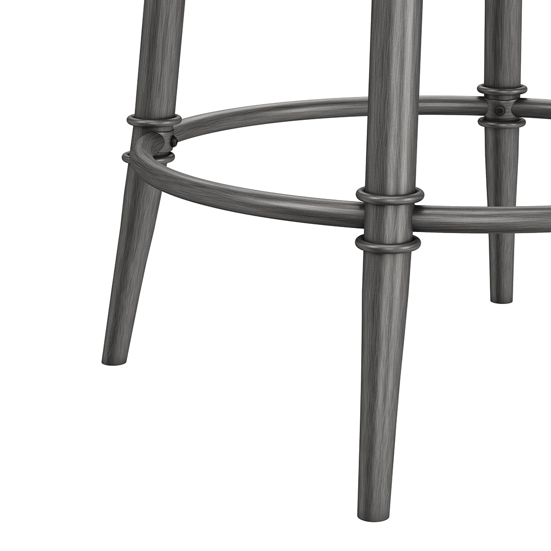 Close-up of a metal bar stool with a white background