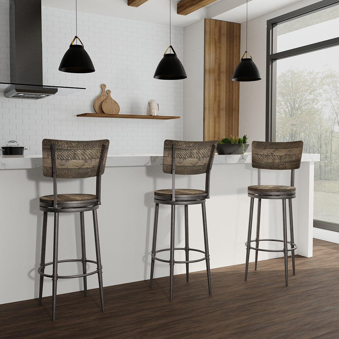 Three bar stools in a modern kitchen setting with pendant lights and a window.