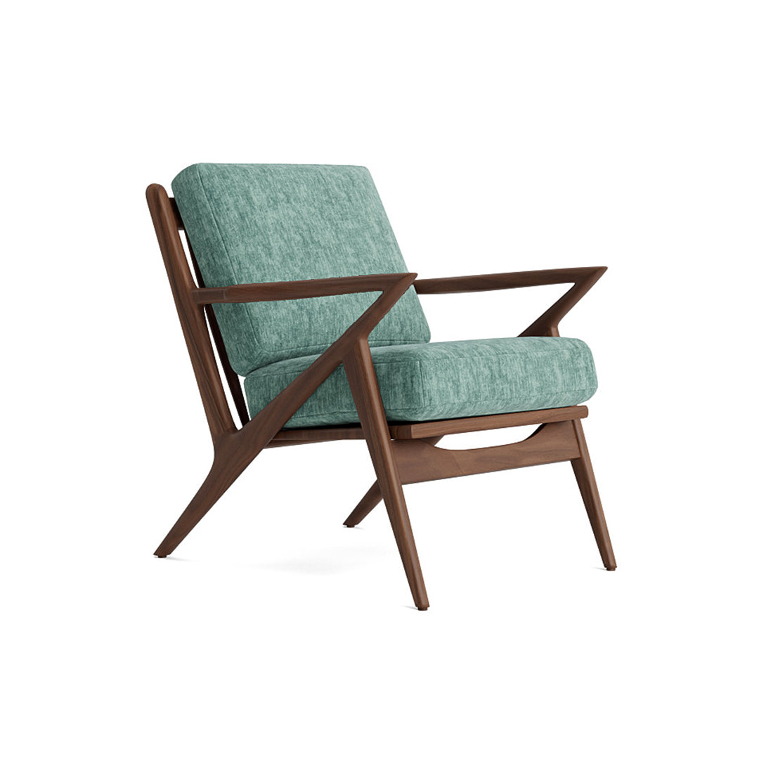 Joybird modern armchair with teal cushion and wooden frame background