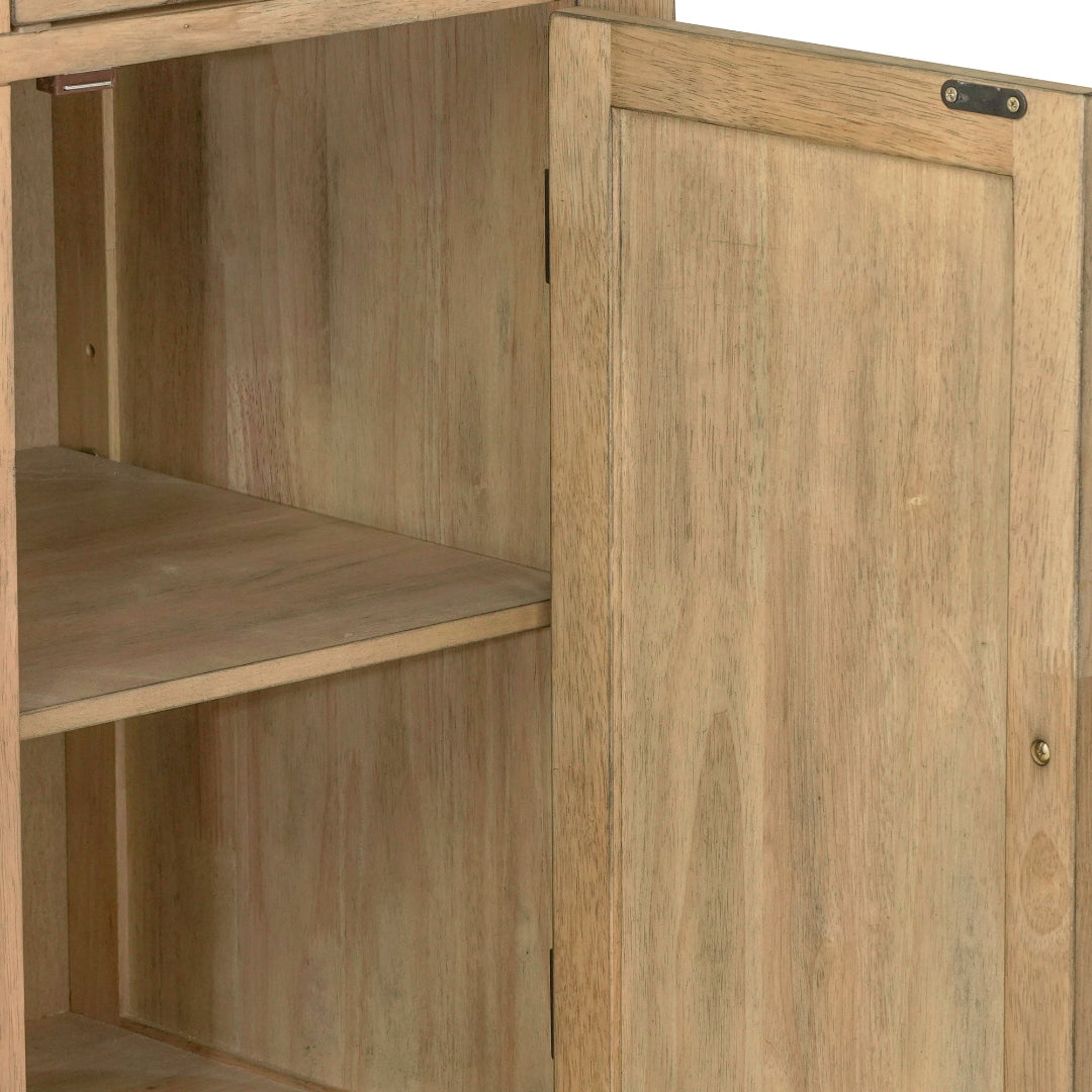 Close-up of a light oak wood cabinet with a single door, a shelf, and visible metal hardware on a plain white background.