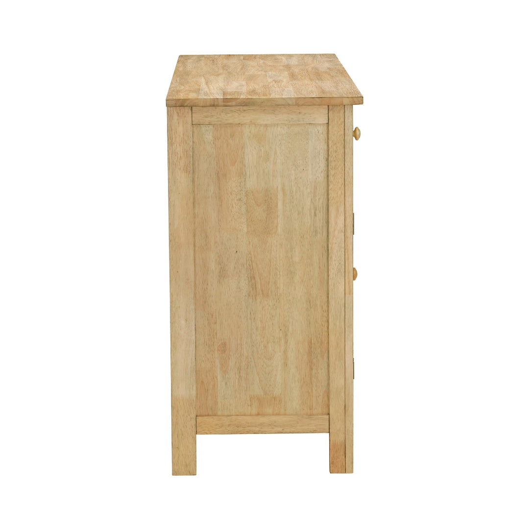 A light natural wood chest of drawers with three drawers and small round knobs, shown from the side against a plain white background.