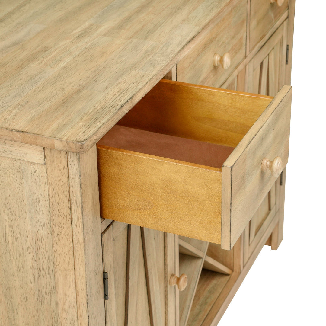 Close-up of a light natural wood sideboard or cabinet with one drawer pulled open, showing the interior and a small wooden pull handle, on a white background.