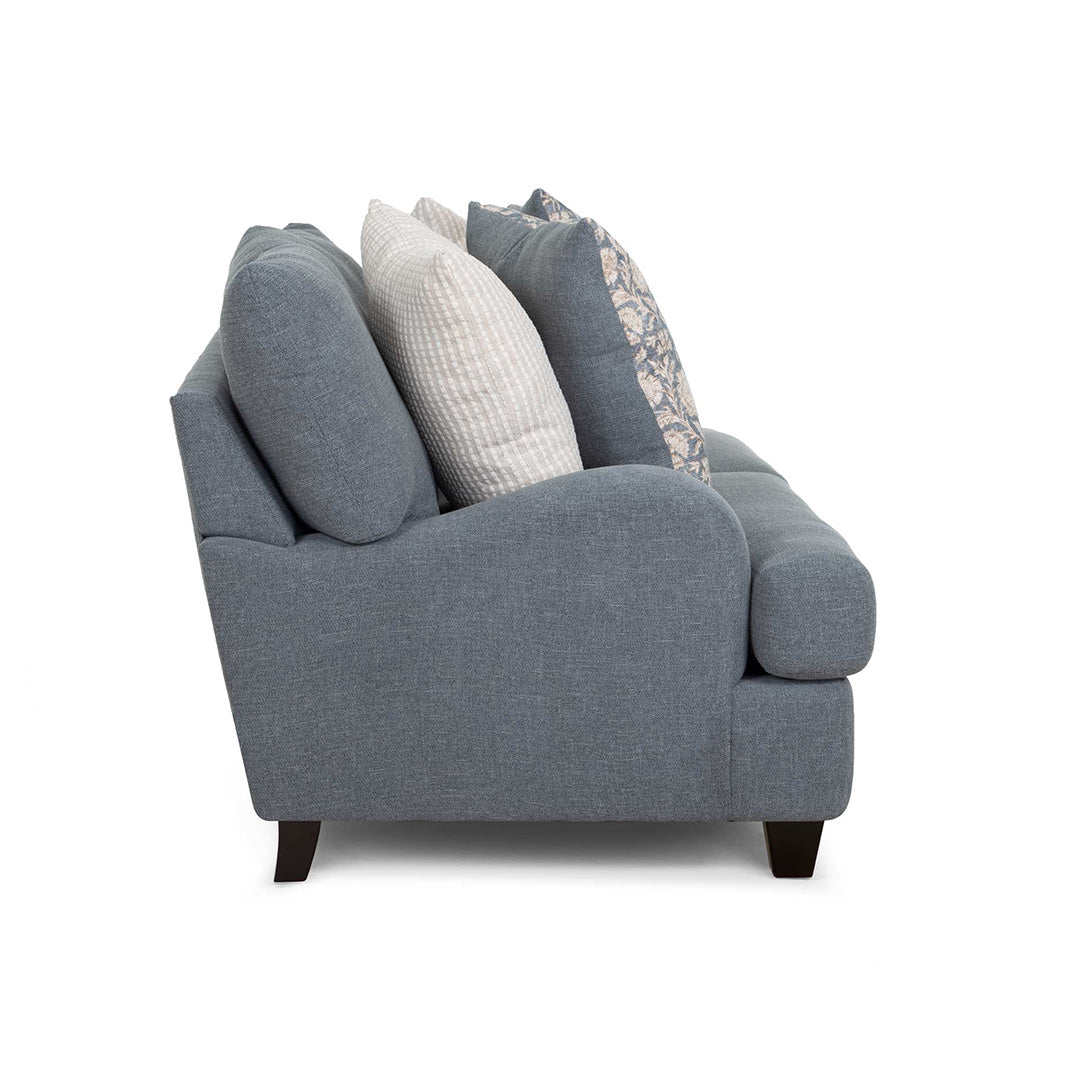 Gray sofa with decorative pillows on a white background