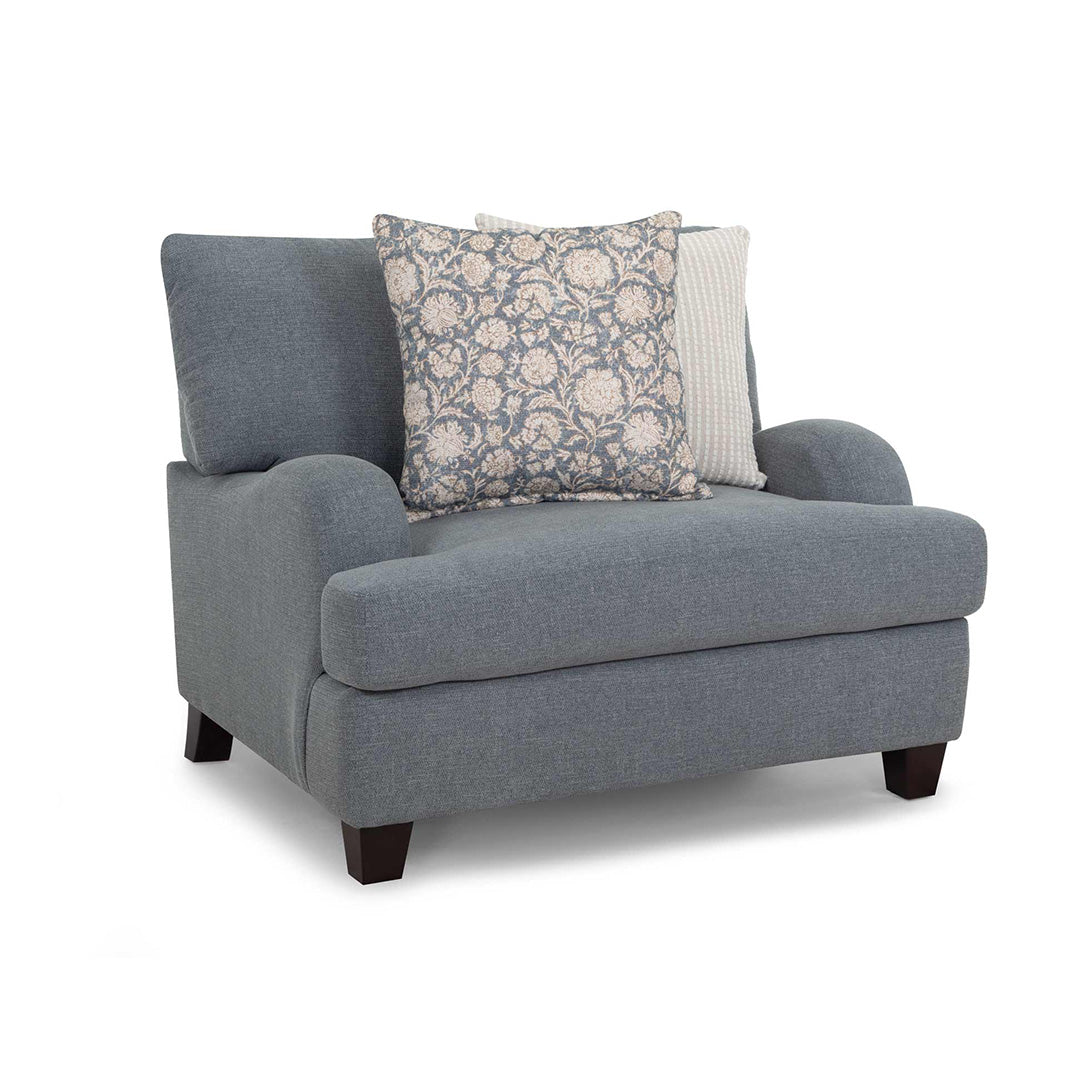 Gray armchair with decorative pillows on a white background