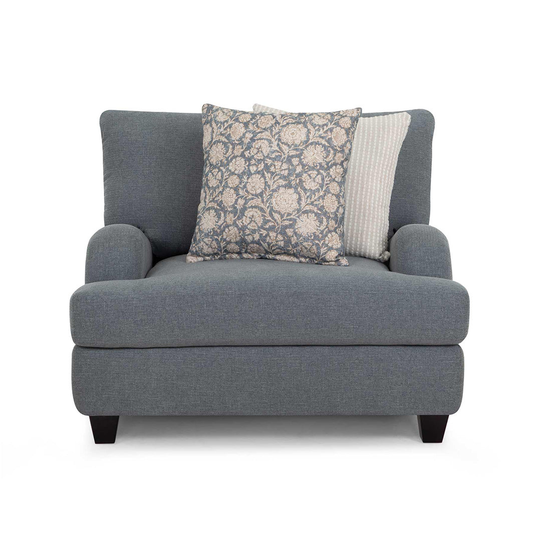 Gray armchair with patterned cushions on a white background