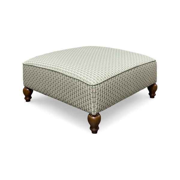 Adeline ottoman in multicolor floral cotton with hardwood frame and wood legs, front view, from Best Home Furnishings