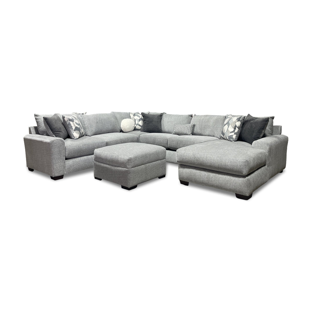 Gray sectional sofa with right chaise and square ottoman.