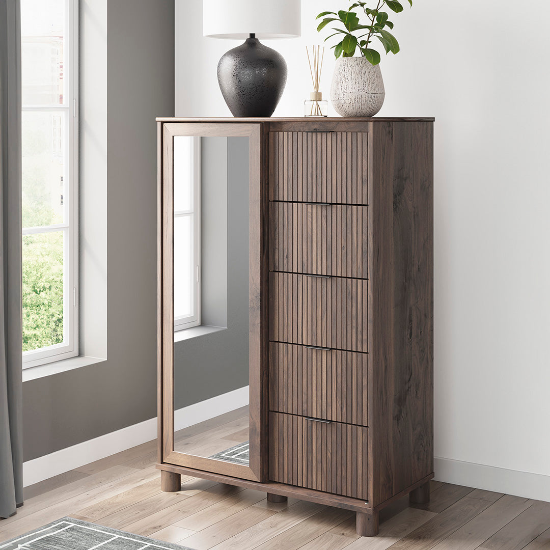 Wooden cabinet with mirror and decorative items in a room with a window.