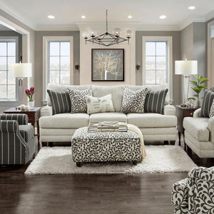 Basic Berber Sofa styled in a cozy living room with bold stripe pillows, patterned accent cushions, and a 'Home Sweet Home' kidney pillow, complemented by warm decor and coffee-finished tapered legs.