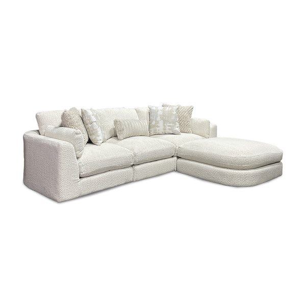 Bombay sectional in beige boucle with modular design and accent pillows, angled view, from Franklin Corporation