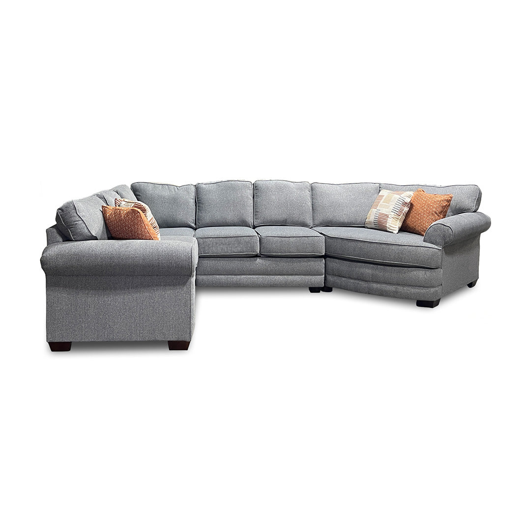 Gray sectional sofa with decorative pillows on a white background