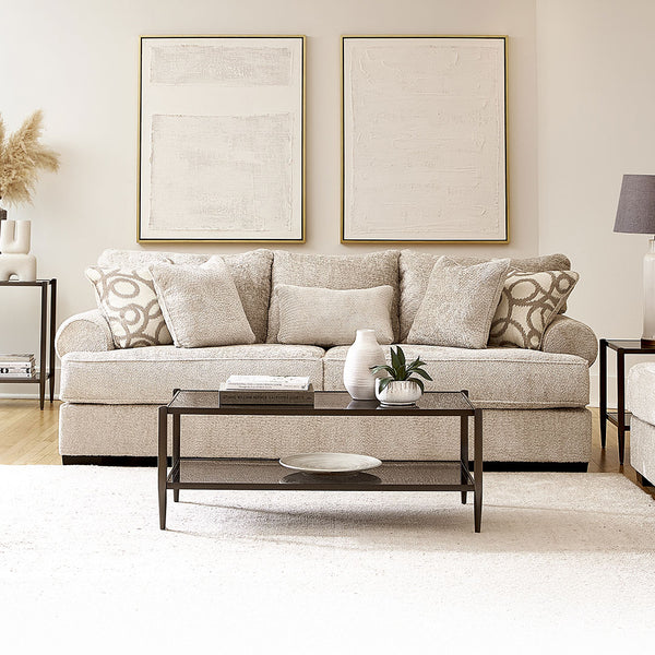 Living room with a made in usa beige sofa, coffee table, and decorative elements.